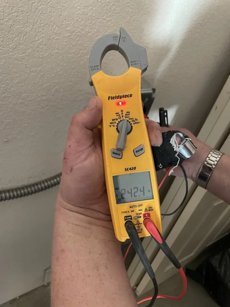 Voltage testing with clamp meter during Electrical Installation Services in Mahtomedi